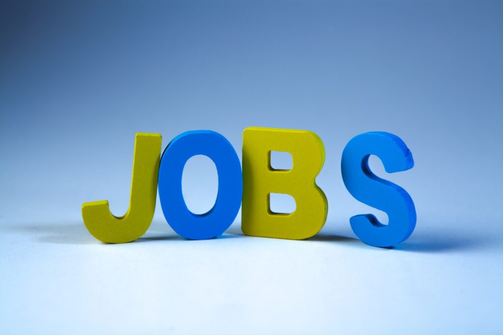Wooden letters forming the word Jobs on a white background. Job concept.